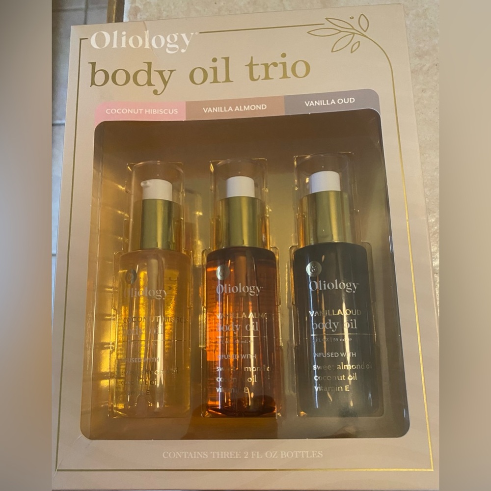Oliology NWT Body Oil Trio set containing three 2 fl oz bottles.